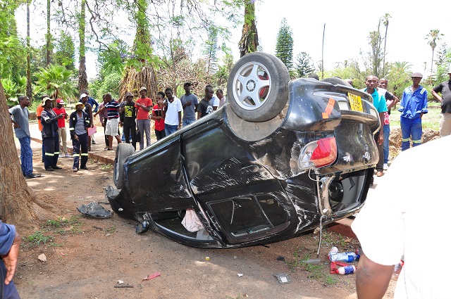 This man who was believed to be driving while on his mobile phone ramed into a tree landed on its roof at Centenary Park in Bulawayo yesterday.(Picture by Stanley Moyo)
