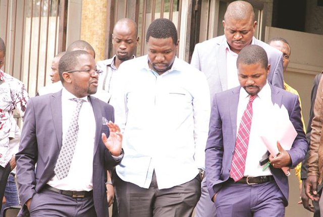 PHD Ministries leader Prophet Walter Magaya (centre) flanked by lawyers Advocate Thabani Mpofu (left) and Admire Rubaya as he made his way out of the Harare Magistrates’ Courts recently. He is expected back at the same court on December 19. (Picture by Innocent Makawa)
