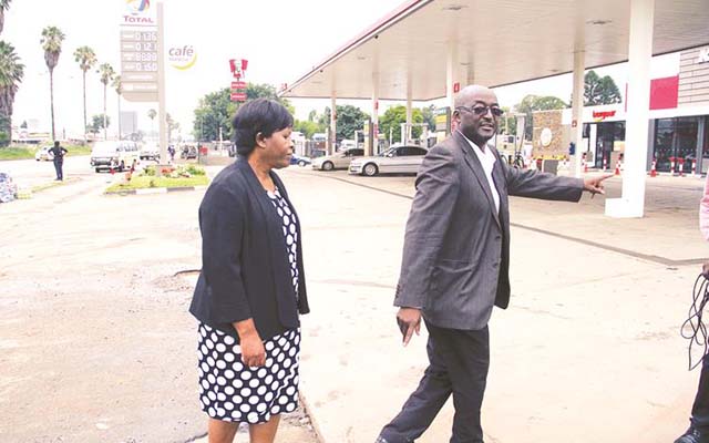 Acting Town Clerk Mrs Josephine Ncube (left) and Harare City Council director of works Engineer Phillip Pfukwa tour the Total Service Station along Simon Mazorodze Road in Mbare yesterday (Picture by Tawanda Mudimu)