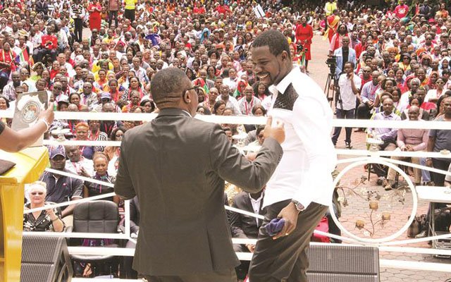 Tourism and Hospitality Industry Minister Dr Walter Mzembi hails PHD Ministries leader Prophet Walter Magaya during the unveiling of the church’s multi-million-dollar prayer mountain in Waterfalls, Harare, yesterday. — (Picture by Innocent Makawa)