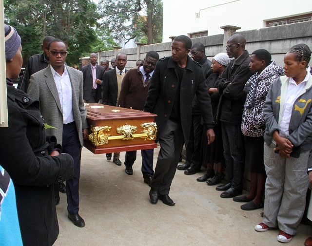 Pallbearers carry the remains of the late Mboneli Ncube who was allegedly mutilated by Rodney Tongai Jindu for a church service at the Jehovah’s Witnesses in the city centre, Bulawayo, yesterday.