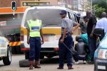 Vendor fined for assaulting spike-carrying cop File Picture: Riot Police was called in to cool public temper after traffic Police officers threw a spike on Tshova Mubaiwa commuter omnibus at the intersection of Hebert Chitepo and 9th Avenue, Bulawayo. In the picture, the driver of the Kombi changes the punctured tyre while the officers guard.