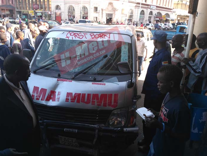 Two passengers were on Friday injured when a Kombi driver evading arrest rammed into a clothing shop along Innez Terrace Street