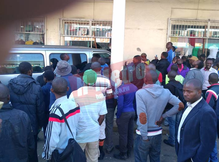 Two passengers were on Friday injured when a Kombi driver evading arrest rammed into a clothing shop along Innez Terrace Street