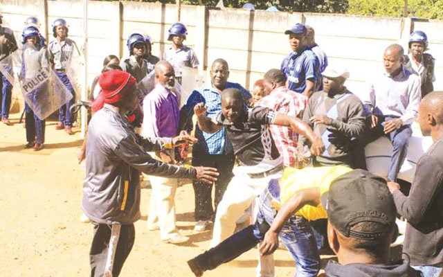 Zanu-PF Youth League members fight at the party’s offices at Davies Hall in Bulawayo