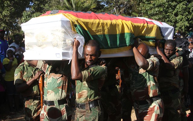 Zimbabwe National Army pallbearers carry the casket bearing the body of Cde Dickson “Chinx” Chingaira to its final resting place at Glen Forest Memorial Park in Harare yesterday. — (Picture by Kudakwashe Hunda)