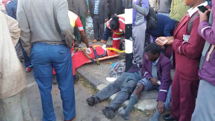 Seven school pupils escaped death by a whisker in Harare yesterday when a commuter omnibus they were travelling in overturned along Kwame Nkrumah Avenue while police officers on a motorcycle were in hot pursuit.