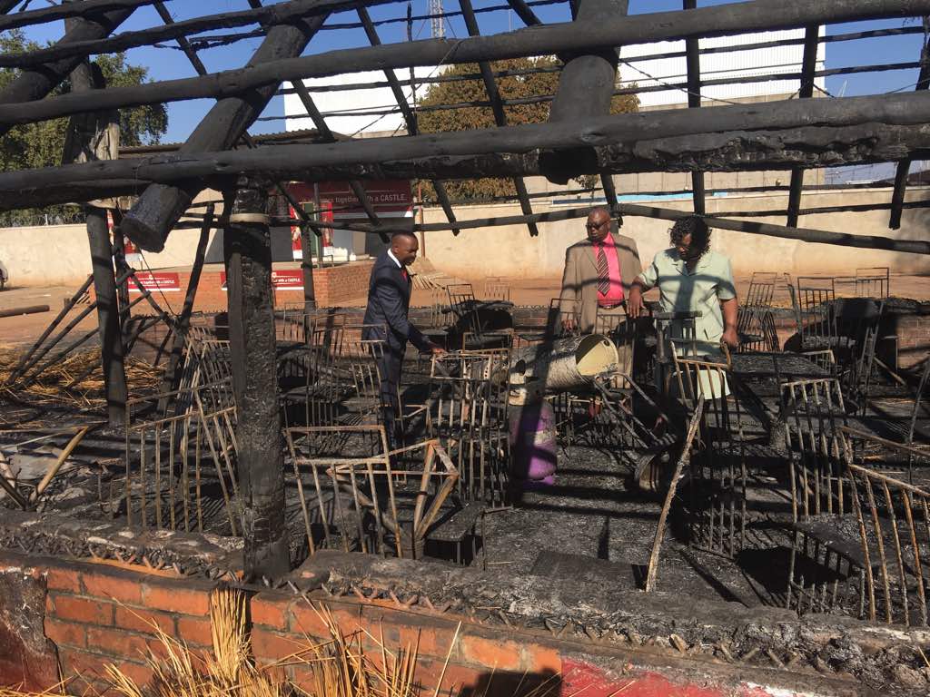 MDC co-Vice President Nelson Chamisa pays a solidarity visit to fellow VP Elias Mudzuri after his bar was set on fire by suspected state security agents