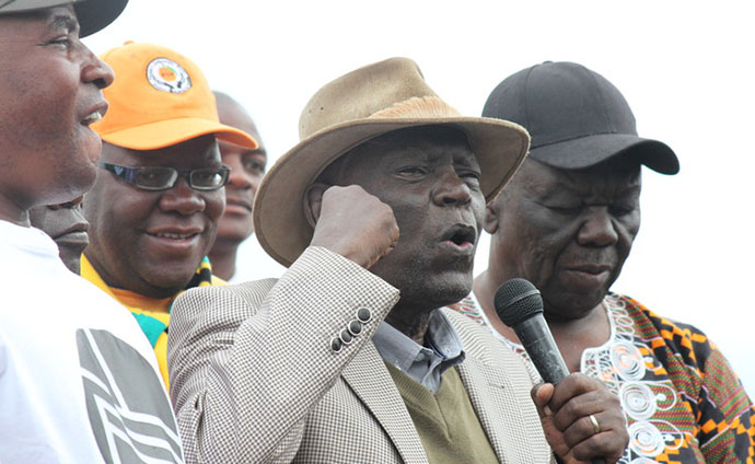 Mr Morgan Tsvangirai (right) and other opposition leaders listen to Mr Didymus Mutasa's address