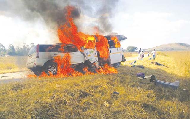 THE JOURNEY THAT NEVER WAS . . . The two vehicles, a Honda CRV and Nissan Caravan are engulfed in flames on impact at the 60km peg along Mvurwi-Centenary Road on Monday