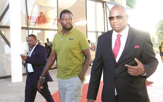 SMART PARTNERS . . . ZIFA president Philip Chiyangwa (right) and Prophet Walter Magaya share notes during a tour of Yadah Hotel complex which has been used by the Warriors