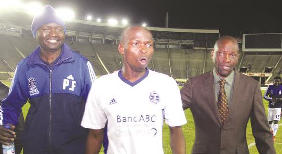 WELL DONE MATE . . . Dynamos coach Lloyd Mutasa (right) congratulates his captain Ocean Mushure after a Castle Lager Premiership match at the National Sports Stadium