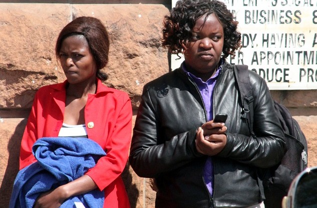Paidamoyo Muranzi (in red Jacket and Cynthia Mugabe (right) in black jacket