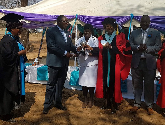 The Minister of Health and Child Care Dr David Parirenyatwa and Zicom president Dr Lilian Dodzo congratulate Sister Nyathi at St Luke’s Hospital yesterday while Matabeleland North provincial medical director Dr Nyasha Masuka (right) looks on (Picture by Thandeka Moyo)