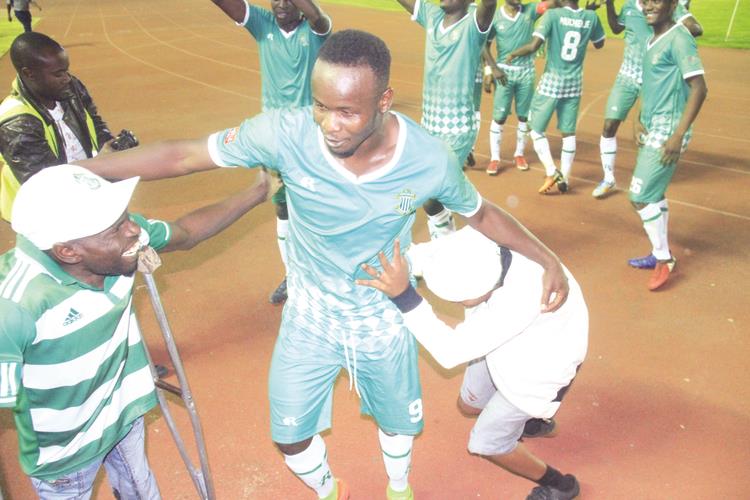 HAPPY PEOPLE . . . CAPS United goalscorer Dominic Chungwa celebrates with the club’s fans after his goal powered the Green Machine to victory last night