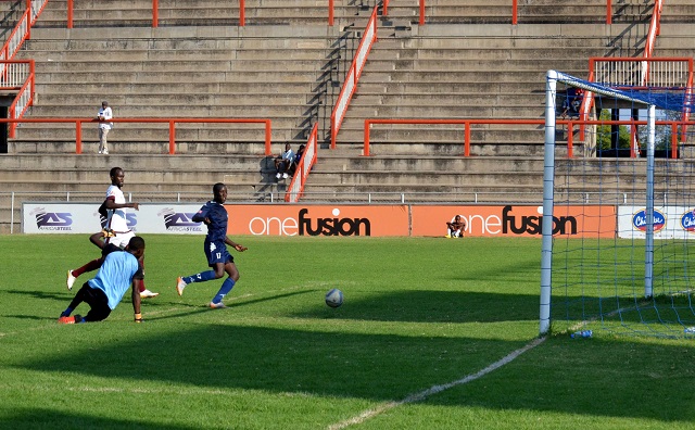 How Mine’s Tinashe Makanda (right) fires past Shabanie Mine goalkeeper Petros Moyo in a Chibuku semi-final at Barbourfields Stadium