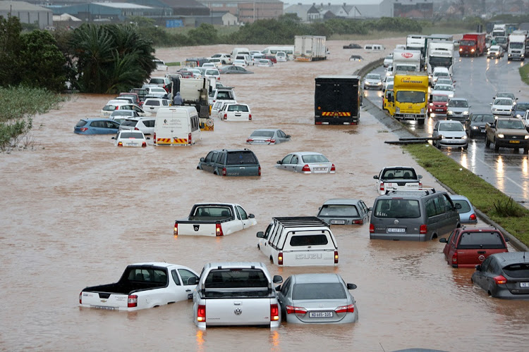 Vehicles stuck in high storm water in Prospecton Road, south of Durban on October 10