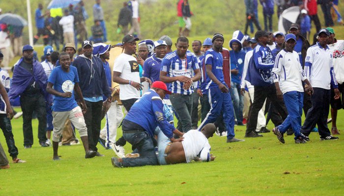 Stung by the reality that they were staring a painful defeat, one that could cost them the Castle Lager Premier Soccer League title, supporters yesterday attacked rival Ngezi Platinum Stars fans and invaded the pitch, bringing their match to a temporary halt.