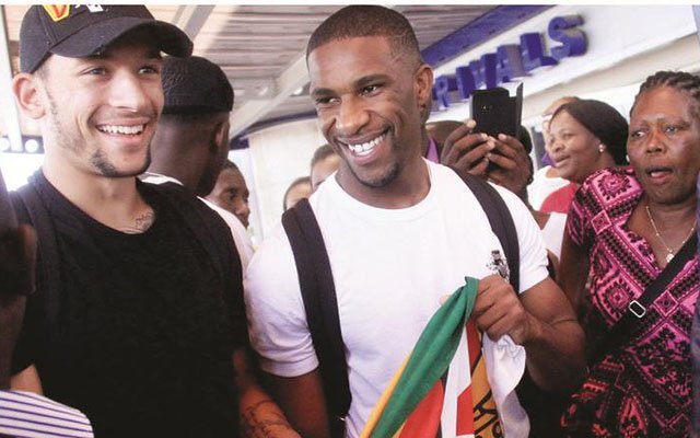 PROUDLY ZIMBABWEAN . . . Macauley Bonne (left) and Tendayi Darikwa mingle with fans soon after their arrival at Harare International Airport in this FILE PICTURE