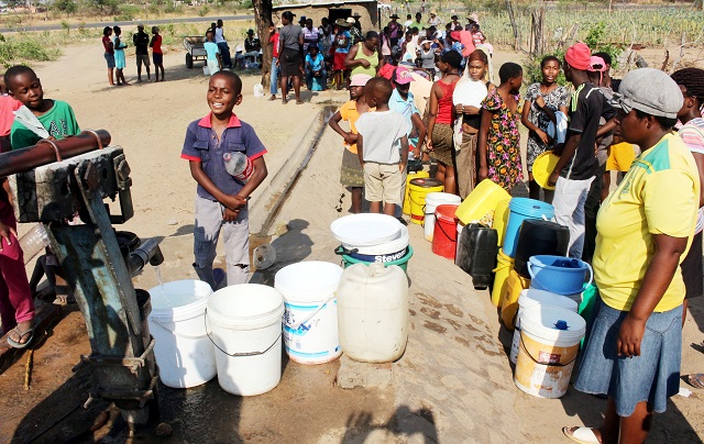 WATER BLUES...Residents queue to fetch water at a Luveve 4 borehole in Bulawayo. (Picture by Eliah Saushoma)