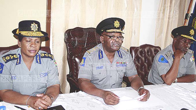 Police Commissioner-General Godwin Matanga (centre), flanked by Deputy Commissioner-General Levy Sibanda and Deputy Commissioner-General (Crime) Josephine Shambare, addresses a Press conference on disturbances that rocked Harare on Thursday night. —(Picture by Shelton Muchena)
