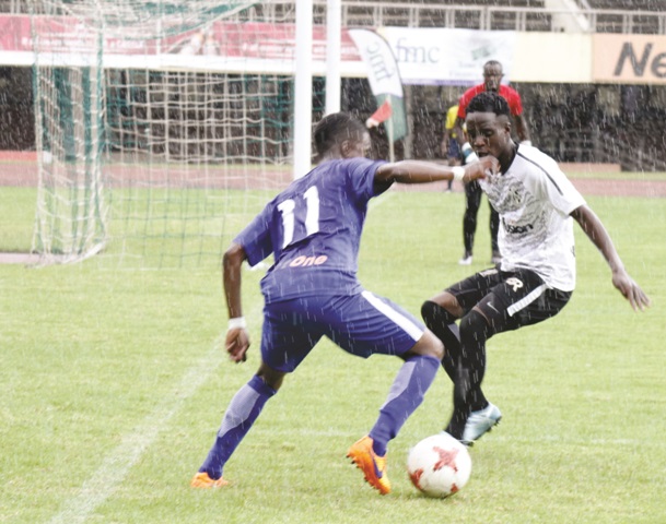 Dynamos left winger Valentine Kadonzvo works his way past Highlanders' Charlton Simangaloma during the ZNA