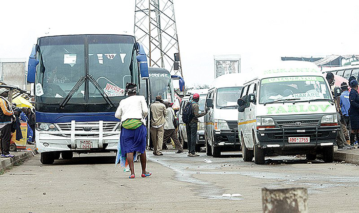 File picture of buses and commuter omnibuses at a terminus