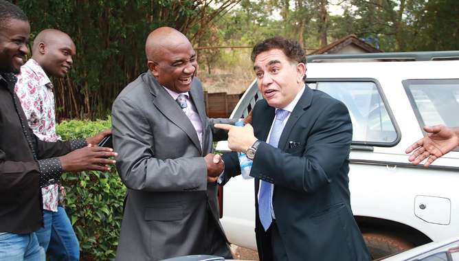 Zifa president Phillip Chiyangwa seen here with fierce rival Trevor Carelse-Juul, a fellow contestant in the poll who claimed he was intimidated by Chiyangwa and filed a police complaint but nothing was done