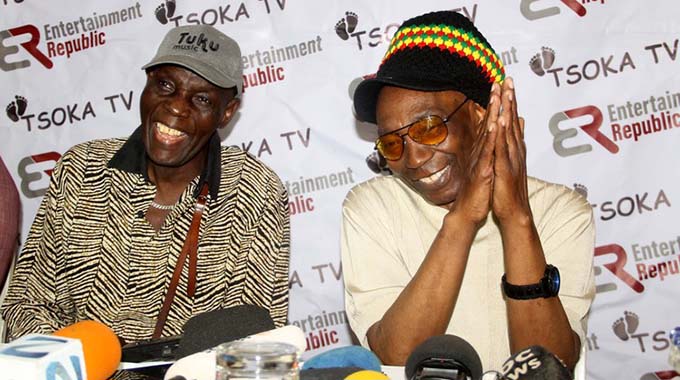 Legendary chimurenga musician Thomas “Mukanya” Mapfumo (right) shares a lighter moment with Dr Oliver Mutukudzi addresses the media at a presser in Harare.- Picture by Tariro Kamangira