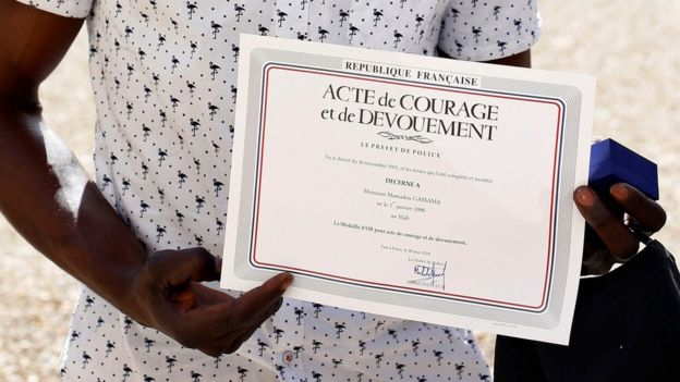 Outside the presidential palace he showed off a certificate he was given