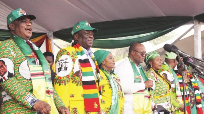 President Mnangagwa and First Lady Auxillia Mnangagwa are introduced by Vice President Constantino Chiwenga (left) to a crowd gathered for a rally at Murambinda B Primary School in Buhera on Saturday following his visit to assess progress in the construction of Marovanyati Dam. Also with him are Zanu-PF national chairwoman Oppah Muchinguri-Kashiri (fifth from left) and Zanu-PF Manicaland provincial chairman Mike Madiro (fourth from left). - Picture by Tawanda Mudimu.