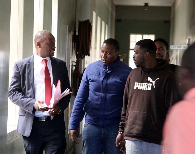 Murder suspects Adrian Mguni and Michael Ndebele before their court appearance at the Magistrates Courts in Bulawayo