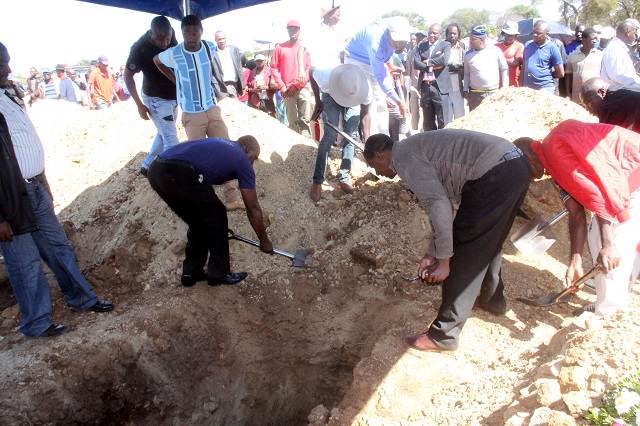 Mourners at the burial of Bongani Ndlovu at West Park Cemetery in Bulawayo yesterday