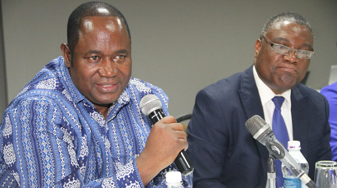 Special Economic Zones (SEZ) Authority board chairperson Dr Gideon Gono and the CEO of the organisation Edwin Kondo follow proceedings during a special economic zones media briefing in Harare yesterday. —(Picture by Memory Mangombe)