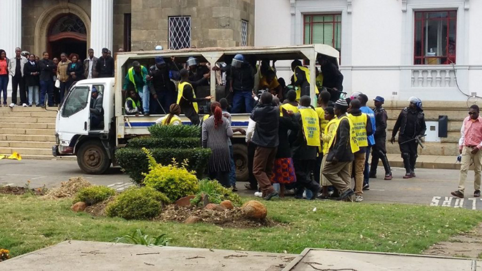 File picture of riot police disrupting a protest by vendors outside Harare Town House