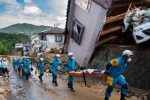 Japan floods: At least 100 dead in record rainfall Tens of thousands of rescuers, including police and soldiers, are taking part in search operations