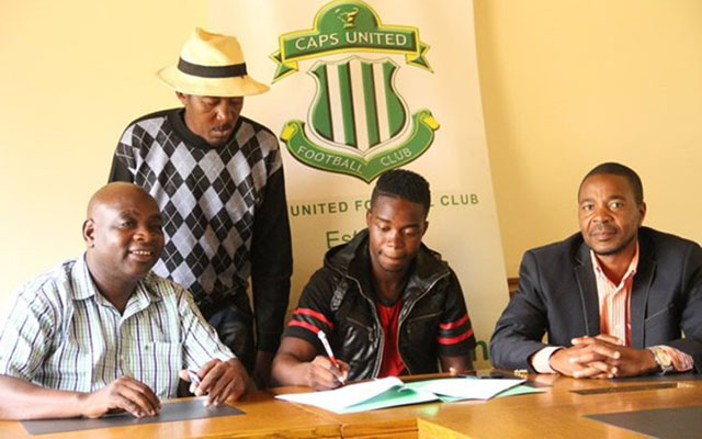 CHIEF DEALER . . . Football agent George Deda (right) looks a satisfied man as his client, Abbas Amidu signs to join CAPS United in 2016 while the player’s father, Hussein Amidu (standing) watches his son complete his move to give the Green Machine director Willard Manyengavana a reason to smile