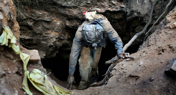 A miner emerges from a shaft in this file photo