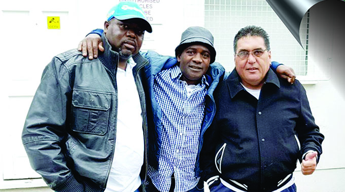 LEGENDS . . . Former CAPS United midfield kingpin Joe “Kode” Mugabe (centre) enjoys the company of his brother and ex-teammate at Makepekepe, Innocent (left), and the Green Machine’s legendary utility player, Carlos Max, in England recently