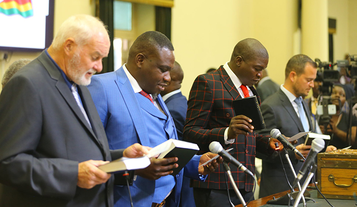 Kuwadzana East MP Chalton Hwende (second left) being sworn into Parliament. (Picture by Brighton Chihwayi - Photo Phactory Zimbabwe)