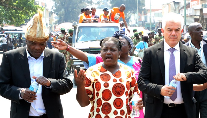 ZTA vice board chair, Mrs Precious Sibiya stresses a point to the CEO Mr Karikoga Kaseke while the advisory board international travel Bourse Berlin Mr Bruno Walters listen as they led a march to comemorate the late VP Joshua Nkomo legacy in Bulawayo yesterday.(Picture by Eliah Saushoma)