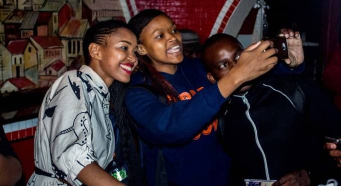 Berita Khumalo poses for a picture with fans at Red Cafe where she performed last Friday. — Picture by Next Level Media