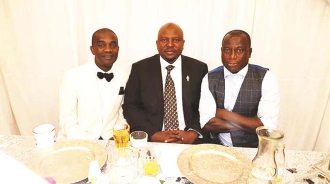 HIGH TABLE . . . CAPS United’s legendary midfielder Joe “Kode” Mugabe (left) celebrated his 50th birthday at Penta Hotel in Reading, England, on Saturday night and was joined in his golden jubilee celebrations by former Dynamos captain Memory Mucherahowa (right) and Team Zimbabwe UK chief executive Marshall Gore