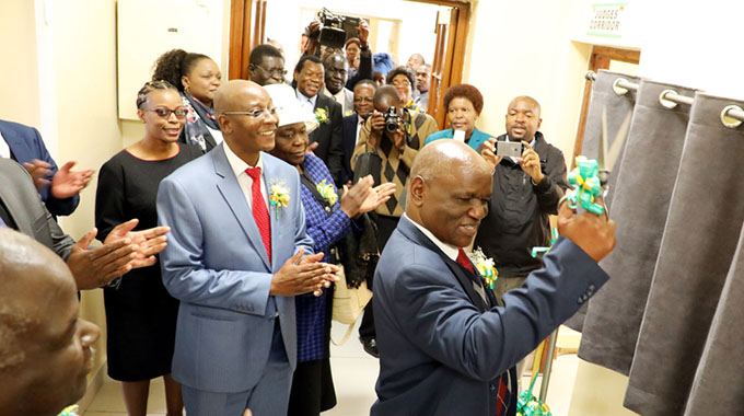 Chief Justice Luke Malaba cuts a ribbon to commission additional courtrooms at Bulawayo High Court. Looking on (from left) are Local Government, Public Works and National Housing Minister July Moyo, Justice, Legal and Parliamentary Affairs Minister Ziyambi Ziyambi, Minister of State for Bulawayo Provincial Affairs Cde Judith Ncube,court officials and guests. - (Picture by Eliah Saushoma)