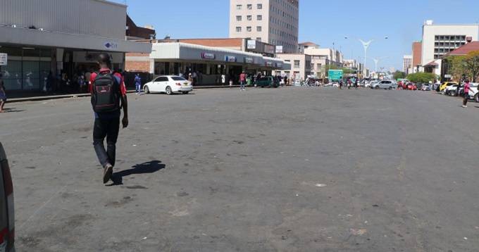A man walks past a deserted area at Chicken Inn as police increased blitz on osiphatheleni in Bulawayo yesterday.