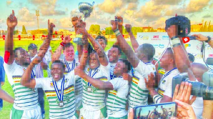 Cheetahs crowned African champs HAIL THE KINGS . . . The Cheetahs celebrate with the Africa Cup after their triumph in Tunisia yesterday.
