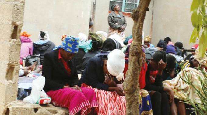 Mourners at the funeral wake for Jameson Mwembe in Mabutweni, Bulawayo