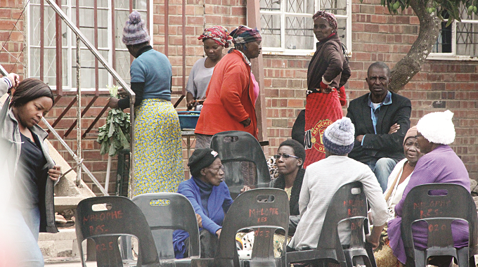Mourners at a funeral gathering after a man ‘killed’ his mother in Mzilikazi, Bulawayo, yesterday