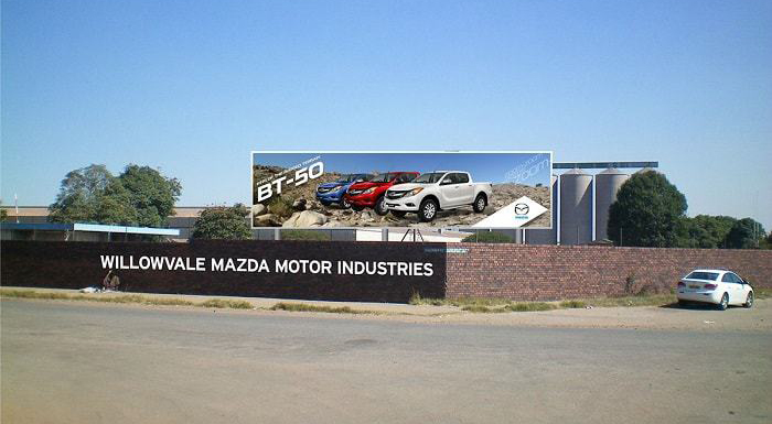 File picture of Willowvale Mazda Motor Industries and the Olivine Industries silos in the background