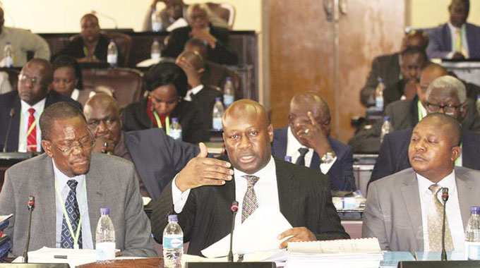 Mines and Mining Development Minister Winston Chitando flanked by his deputy Polite Kambamura (right) and Secretary Onisimo Moyo appears before a Parliamentary Portfolio Committee on Mines and Mining Development in Harare. — Picture by Wilson Kakurira